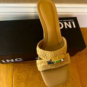 INC slide pumps in tan.